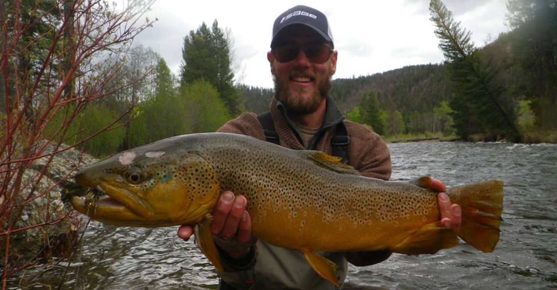 Angler with northern pike on local water